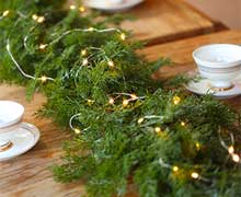 Real-Looking Cedar Garland with lights as Table Runner