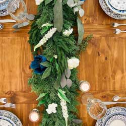 Norfolk pine garland laying on table